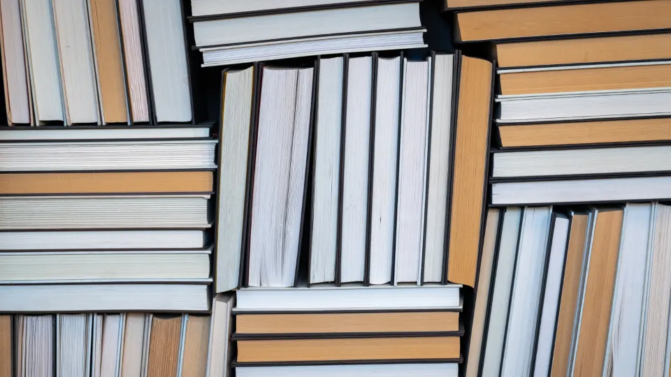 Stacks of books arranged in alternating rows