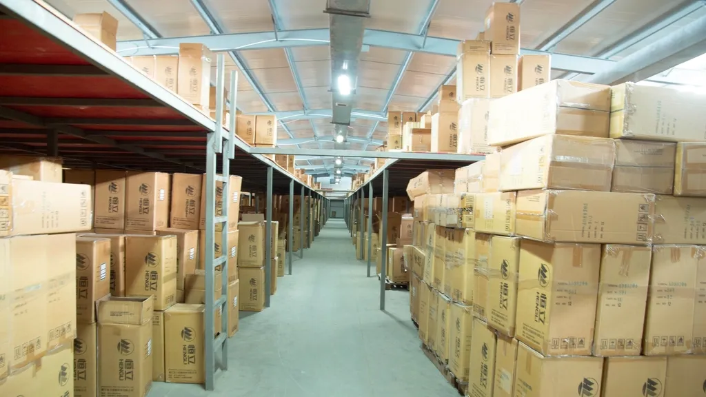 Rows of cardboard boxes on shelves in a warehouse