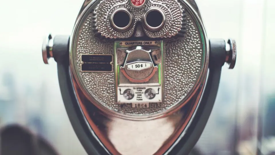 Coin-operated tower viewer binoculars at a city lookout