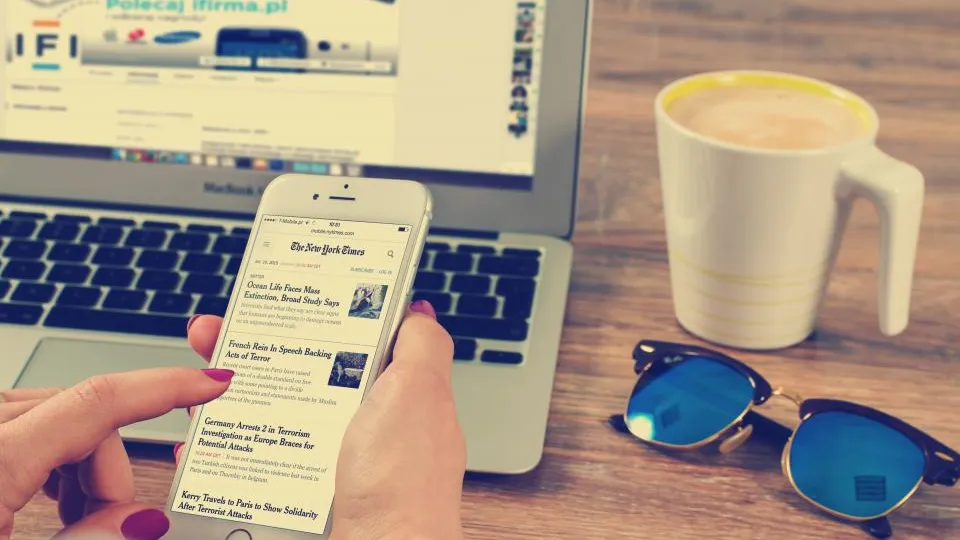 Person reading an online news article on a smartphone