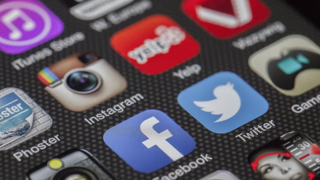 Close-up of social media app icons on a smartphone screen