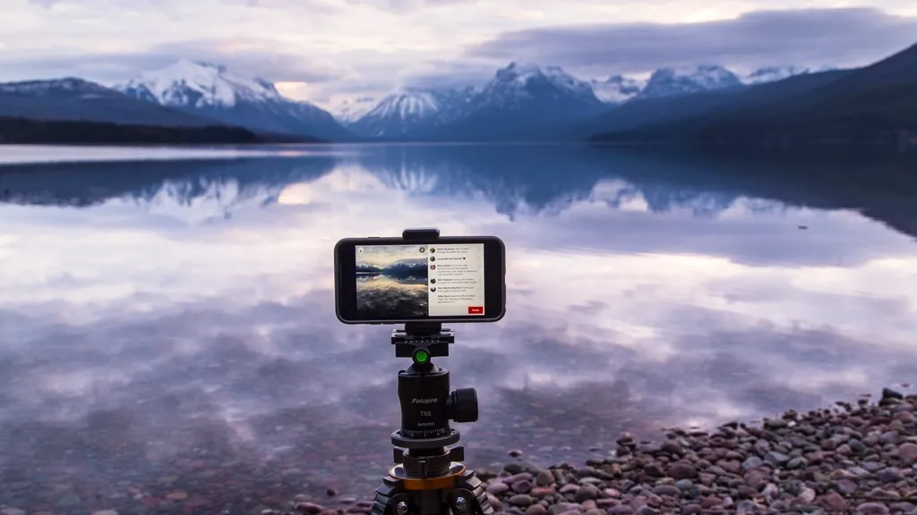 Smartphone on a tripod filming a mountain lake