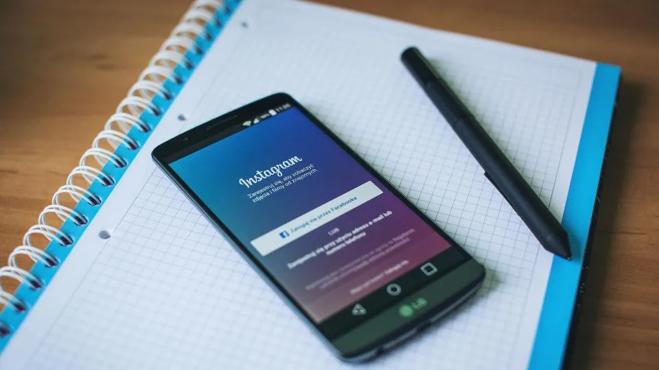 Smartphone showing the Instagram app on a desk