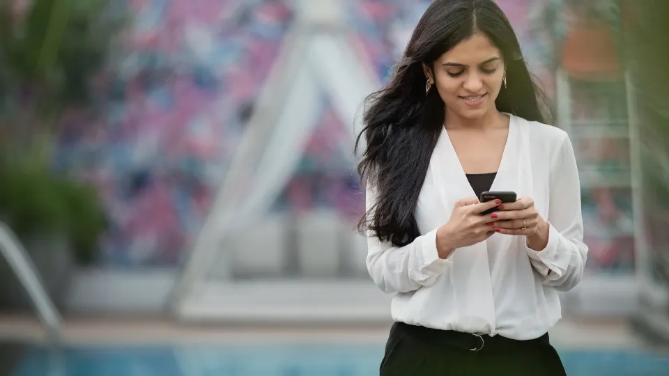 Woman reading a text message on her phone