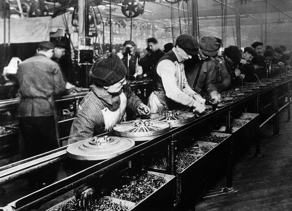 Workers on Ford's moving assembly line, 1913