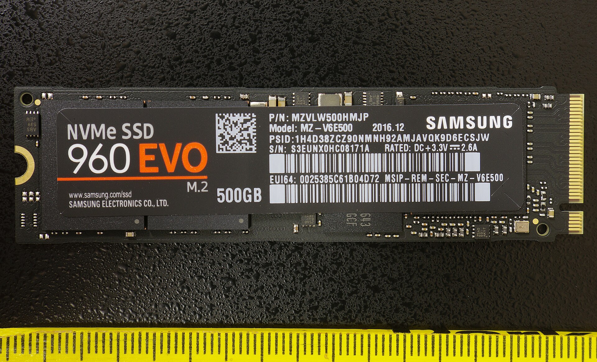 Samsung 960 EVO M.2 SSD beside a centimetre ruler: a small circuit board with no moving parts